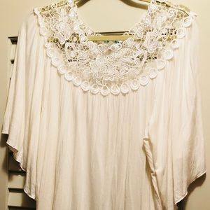 White (creamy white/lace white) women’s shirt.